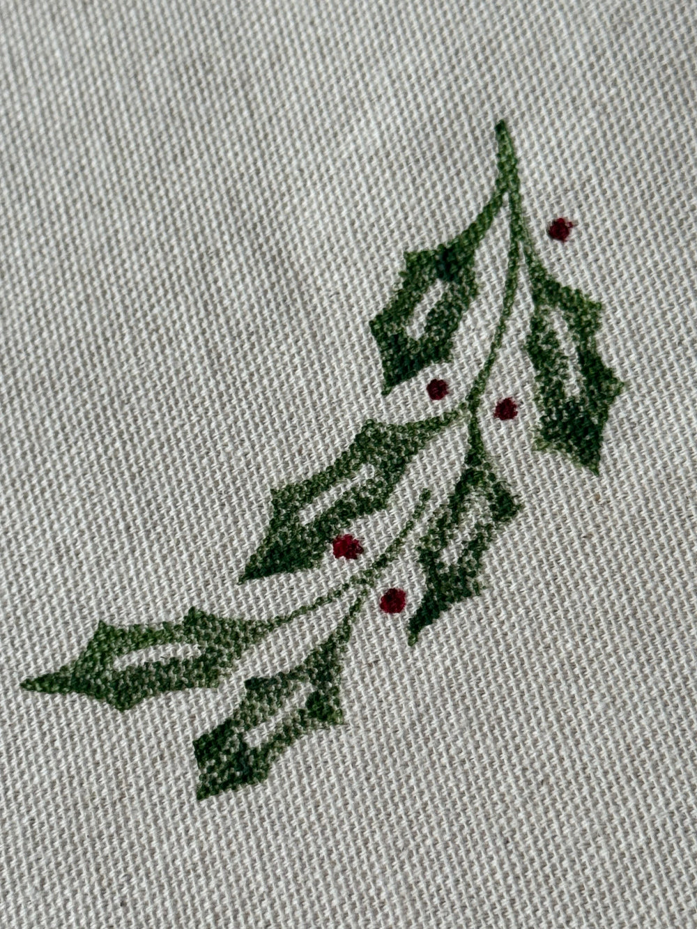 spray of holly and berries using Indian Blok prints on organic cotton table runner and napkin