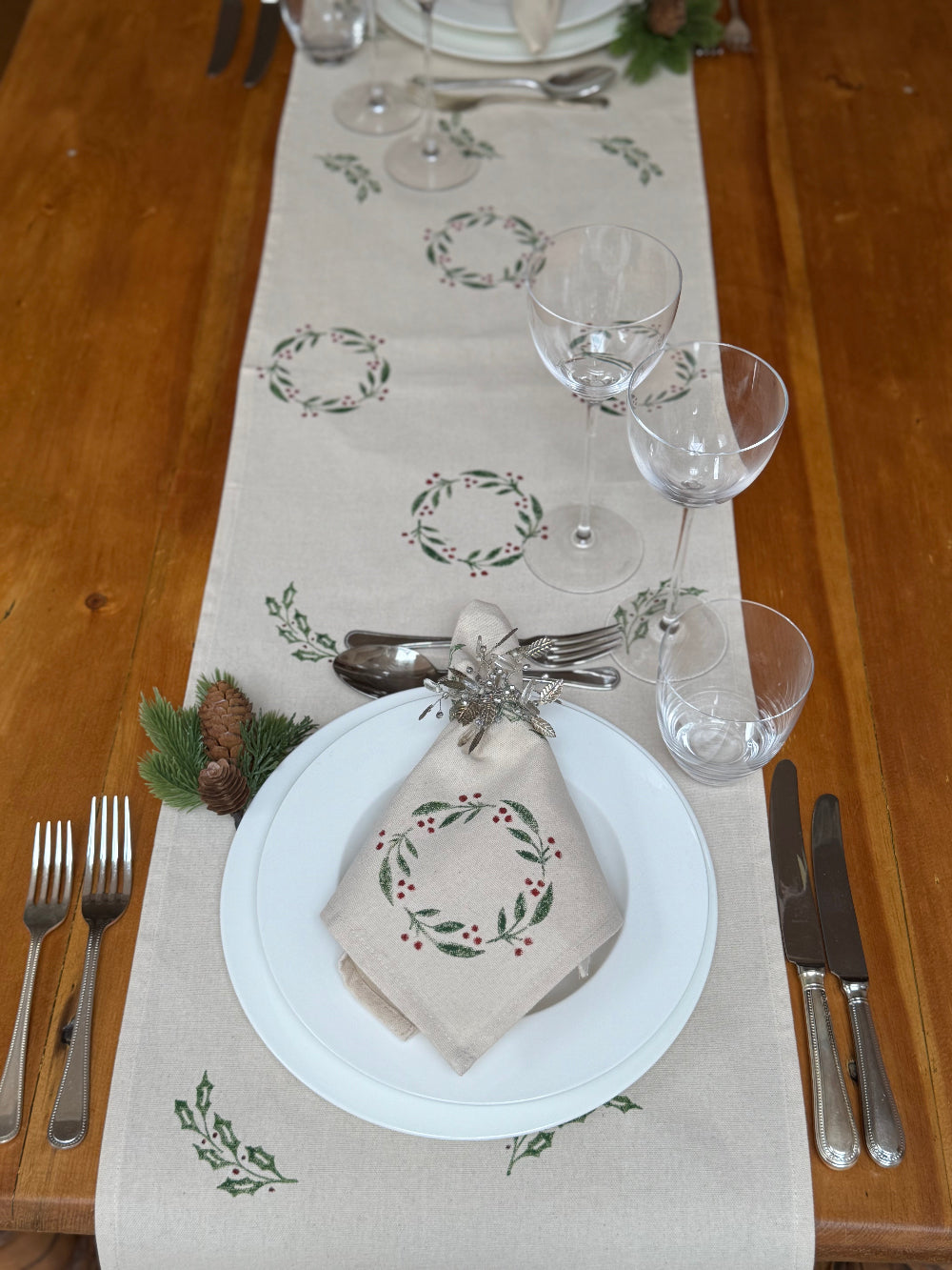 Decorative table setting with a festive hand block printed runner and napkin
